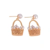 The new mid-style pearl flower basket earrings are niche, exquisite and high-end. The stud earrings are fashionable, elegant, trendy and versatile Item Picture